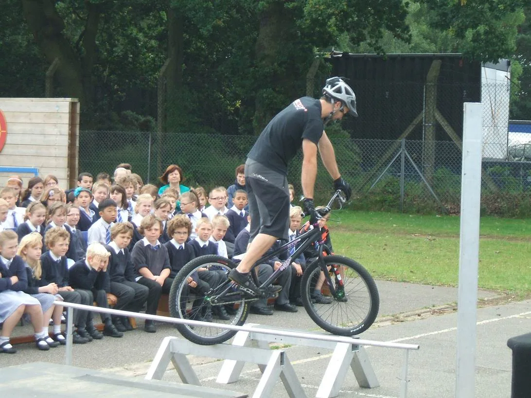 School pupils watching a 3SIXTY rider on a balance beam